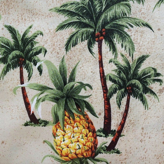 Détail motif Ananas dorés et Cocotiers vert sur fond beige naturel 100% coton