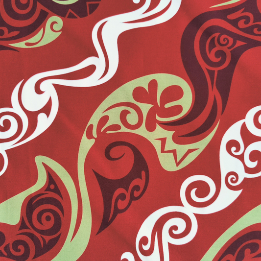 Détail motif Tatouages polynésiens géométriques vert anis blanc sur fond rouge 100% coton