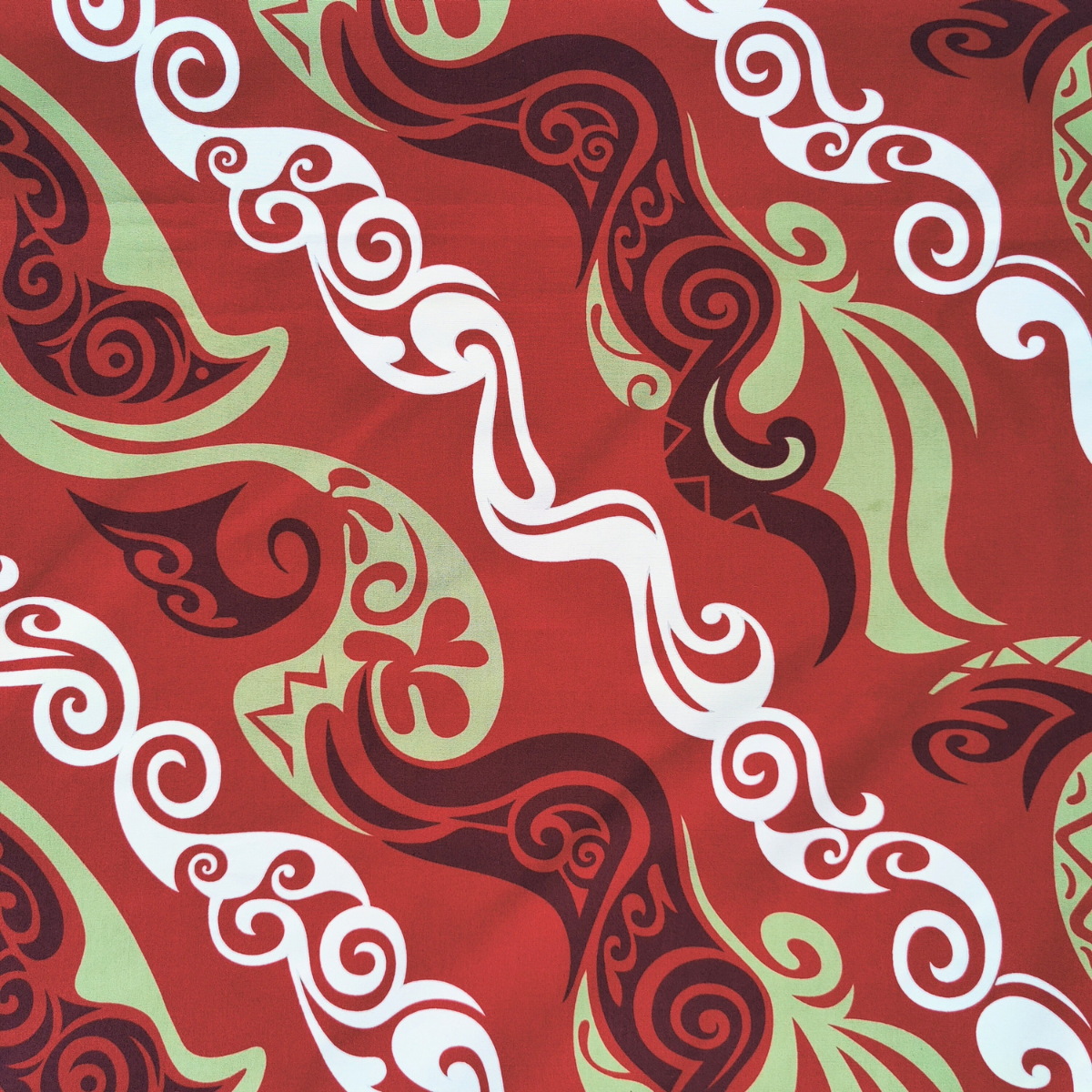 Tissu motif Tatouages polynésiens géométriques vert anis blanc sur fond rouge 100% coton