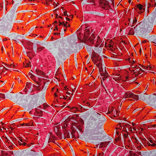 Détail motif Monstera rouge corail orange rose éclatants sur fond gris perle 100% coton