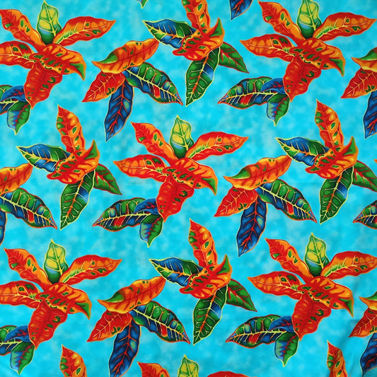Tissu tahitien en coton, motifs crotons orange et vert sur fond bleu turquoise. Tissu exclusif - dernier coupon.