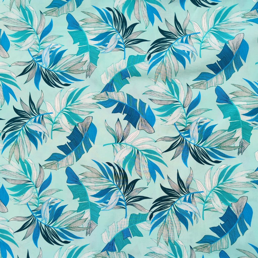Tissu tahitien en coton, détails des motifs feuilles de bananiers et fougères , camaïeu de bleu. Edition limitée - aucun réassort.