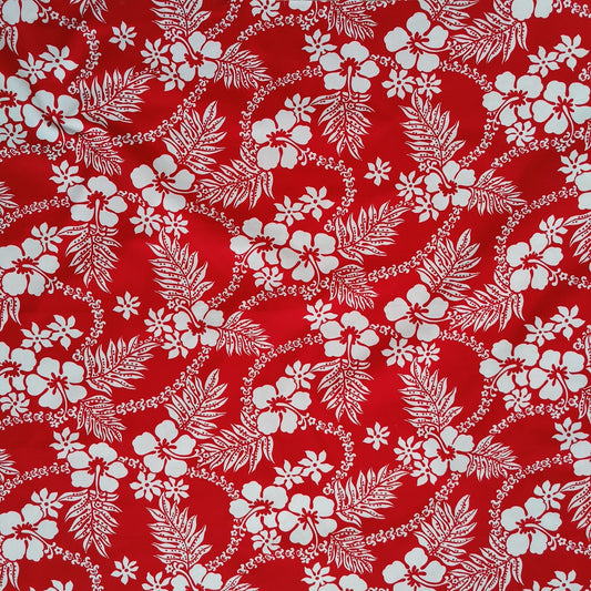Tissu tahitien en coton, motifs hibiscus, fougères et tiarés blanches sur fond rouge vif. Edition limitée, dernier coupon.