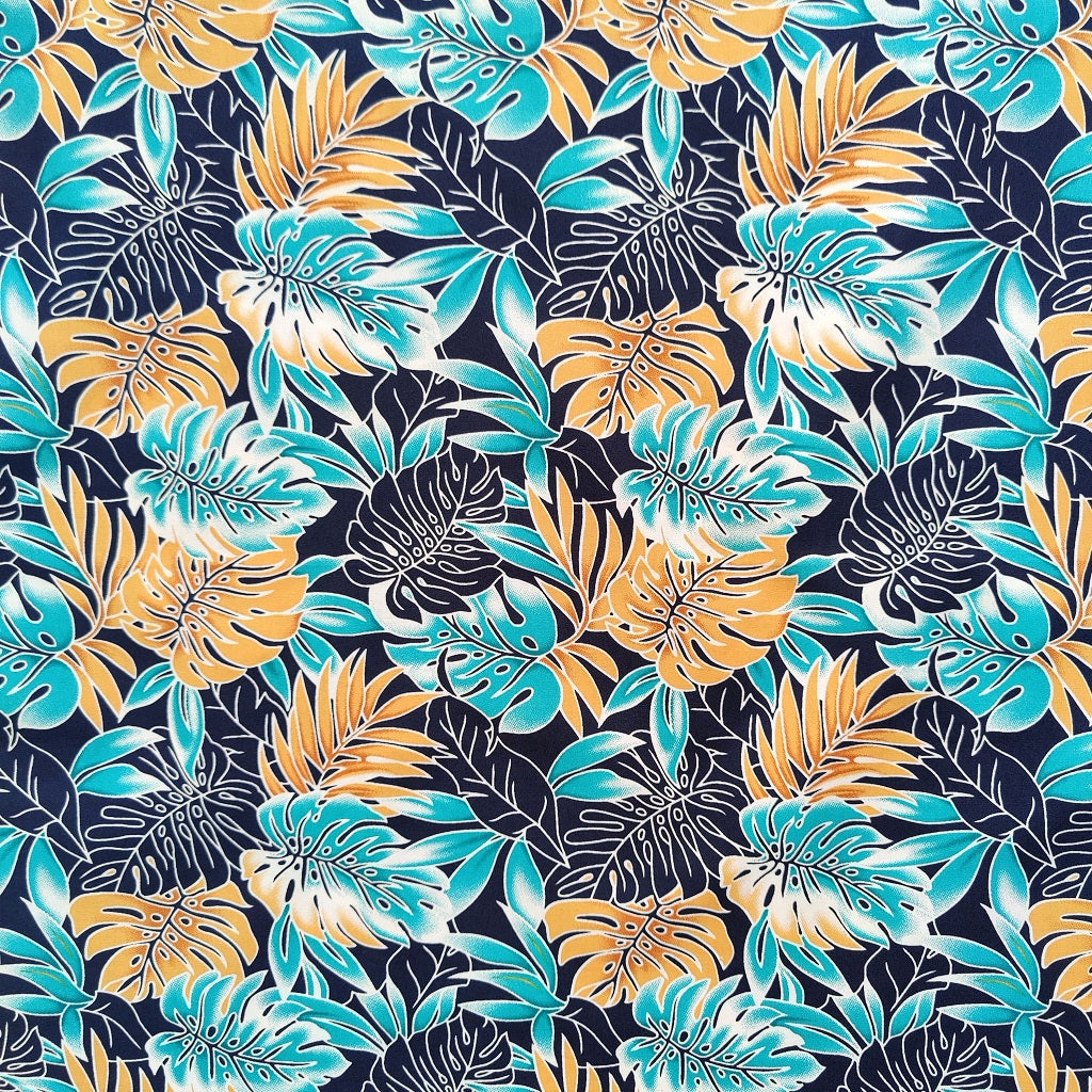 Tissu tahitien monstera en coton - couleurs bronze turquoise et bleu marine - Dernier coupon.
