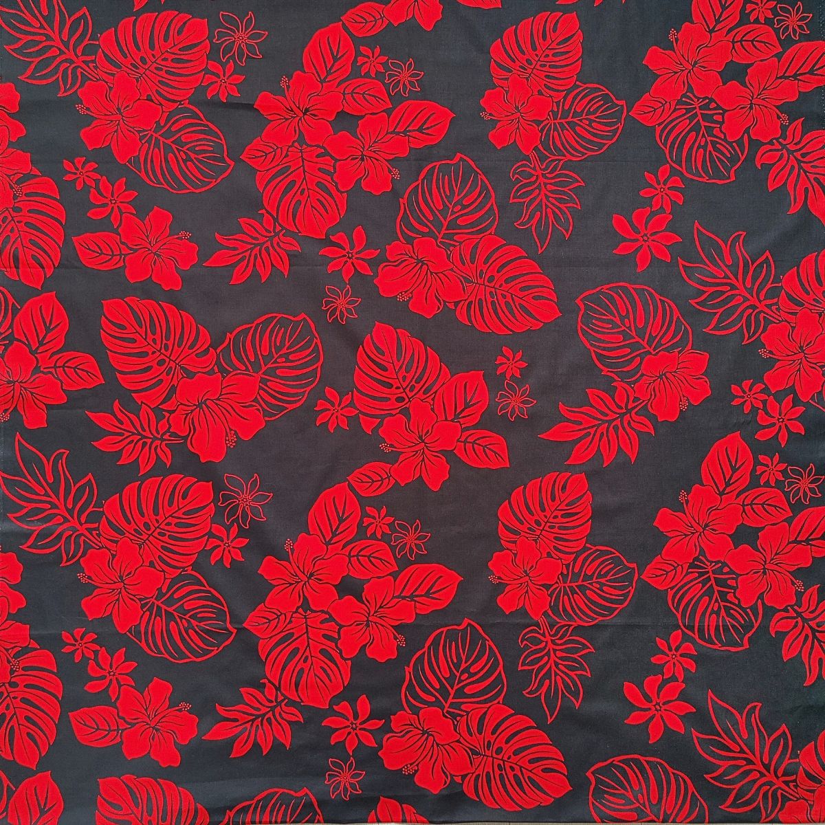 Tissu fleuri en coton hibiscus et monstera rouge et noir