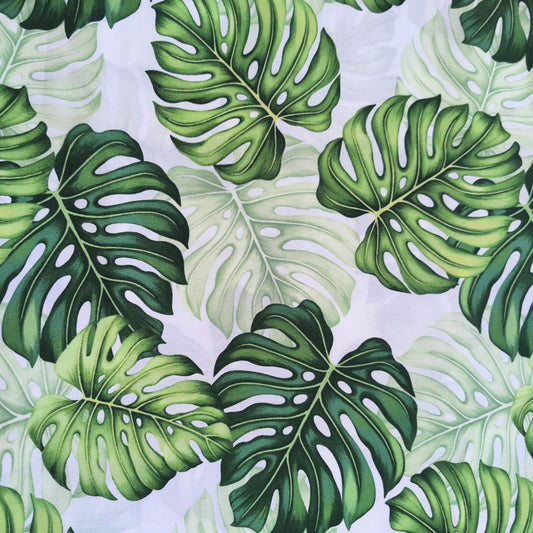 Détail motif Monstera aquarelle vert émeraude anis sauge sur fond blanc 100% coton