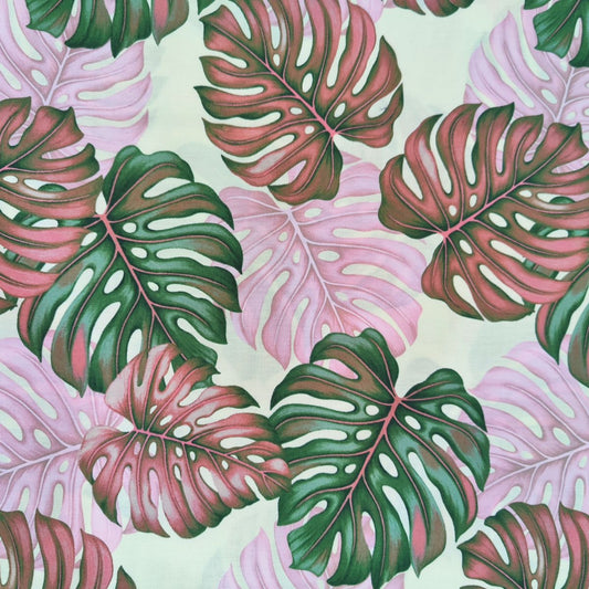 Détail motif Monstera aquarelle vert tendre rose délicat sur fond clair 100% coton