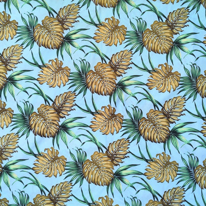 Tissu coton Monstera et Fleurs tropicales vert olive fond turquoise motifs polynésiens Couleurs du Fénua