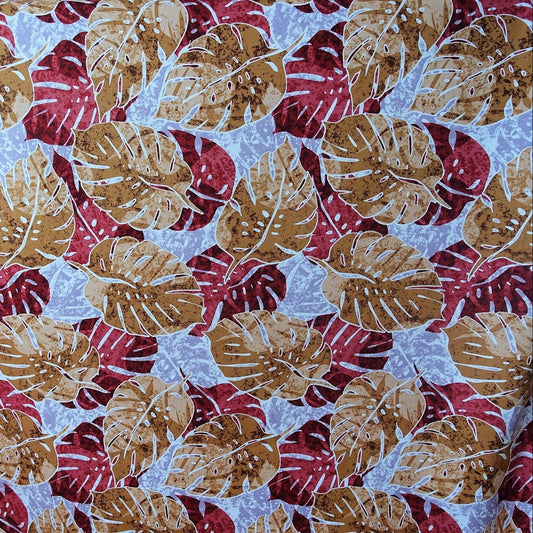 Tissu coton Monstera marron bordeaux fond bleu gris motifs tropicaux polynésiens Couleurs du Fénua