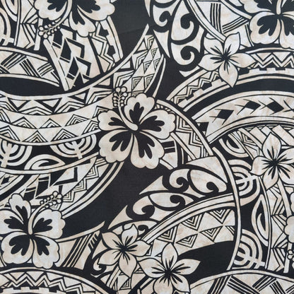 Détail tissu coton polynésien noir et beige - motifs traditionnels hibiscus, spirales et tatouages géométriques - laize 115 cm