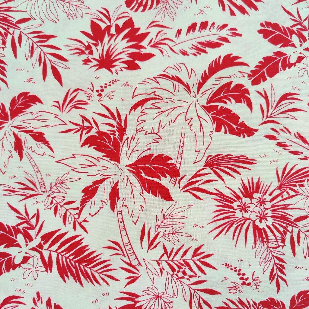 Détails du tissu tahitien en coton, cocotiers et feuillages rouge et beige. Edition limitée