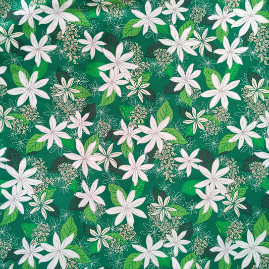 Tissu tahitien en coton, motifs fleurs de tiarés blanches sur fond vert lumineux. Aucun réassort, dernier métrage.
