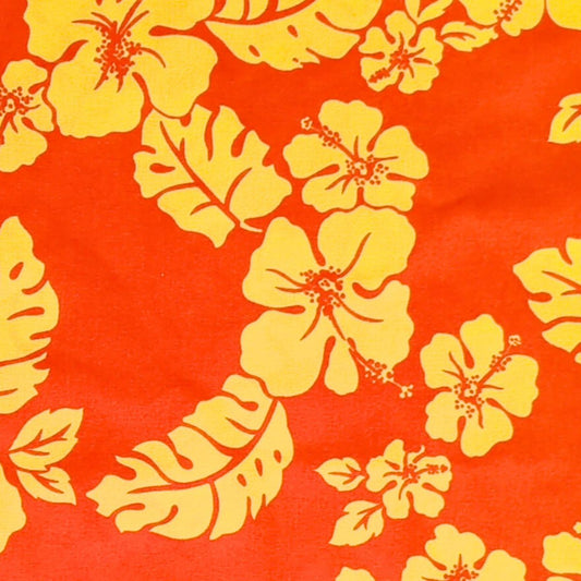Tissu tahitien en coton, détails des motifs Hibiscus et feuillages exotiques jaune sur fond orange vif. 100% coton - Edition limitée