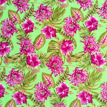 Tissu tahitien en coton motifs hibiscus rose de Chine et monstera, rose sur fond vert anis