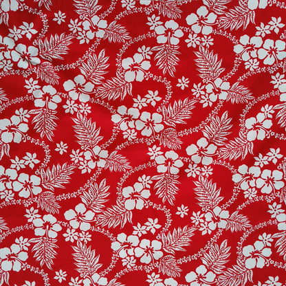 Tissu tahitien en coton, motifs hibiscus, fougères et tiarés blanches sur fond rouge vif. Edition limitée, dernier coupon.