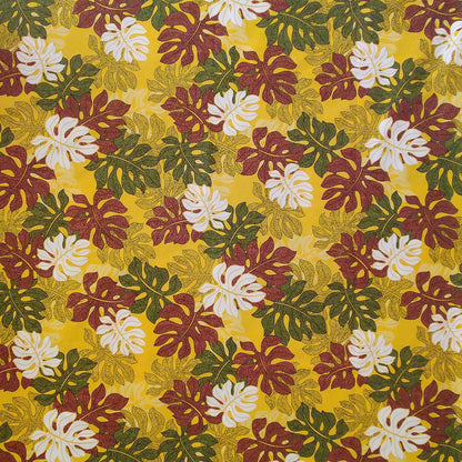 Tissu tahitien en coton monstera marron vert et blanc sur fond jaune