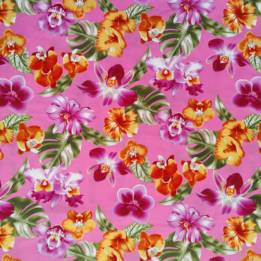 Tissu tahitien en coton, motifs orchidées et hibiscus orange et violet sur fond rose. Edition limitée. Vendu en coupon.