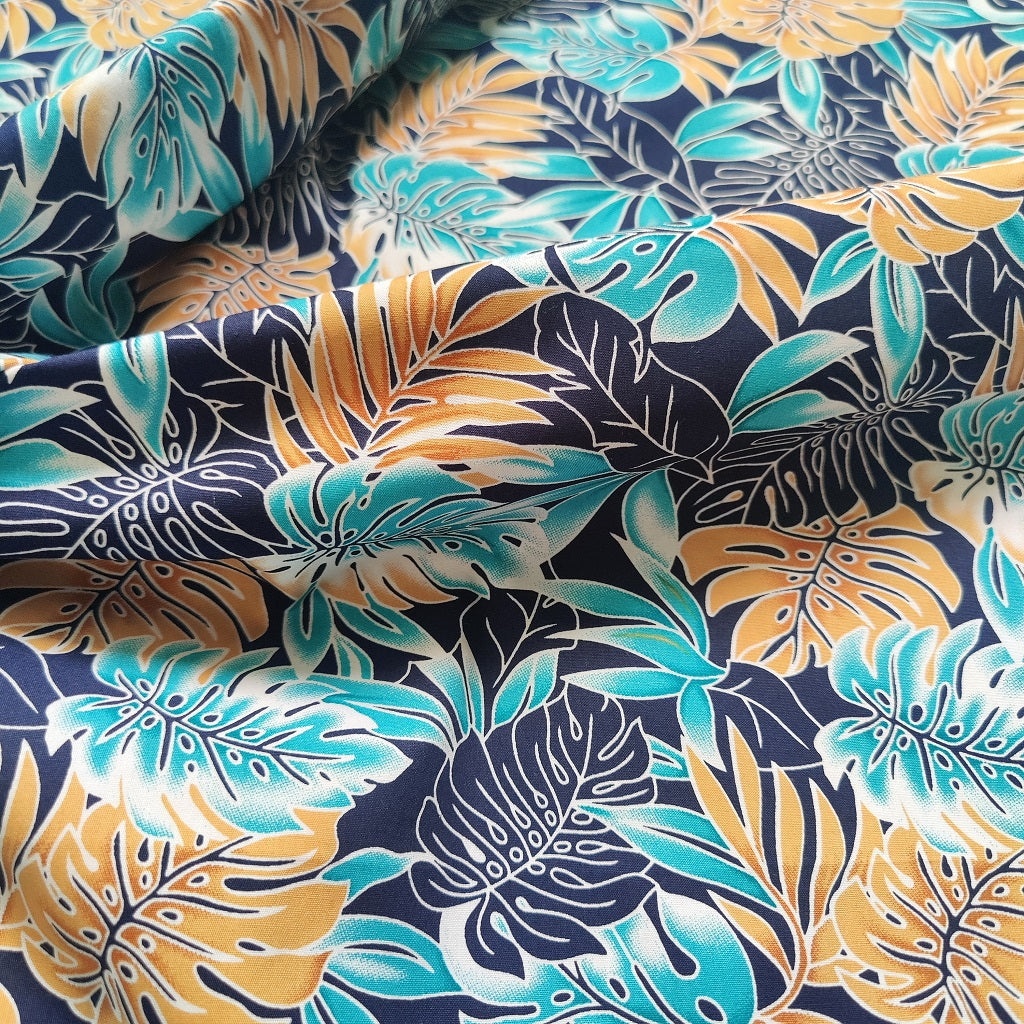 Tissu tahitien monstera en coton - couleurs bronze turquoise et bleu marine - coupon 2 mètres