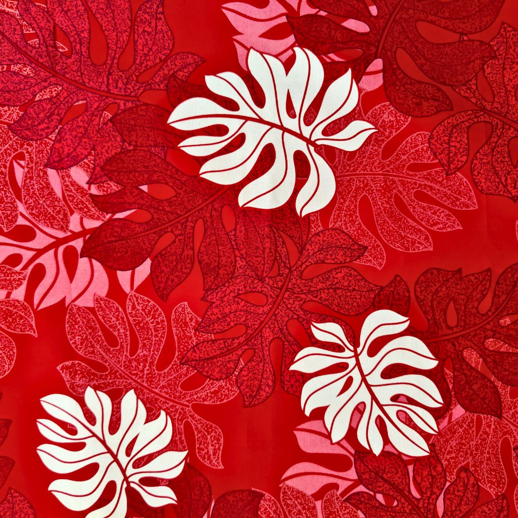 Tissu tahitien en coton, détails du motif  monstera tropical rouge et blanc. Edition limitée - coupon 2 mètres