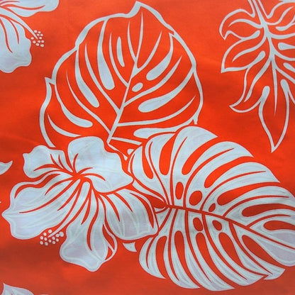 Détails tissu coton hibiscus et monstera orange et blanc
